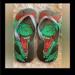 FREE WITH PURCHASE. Boys or gender neutral size 3/4 flip flops with dinosaurs